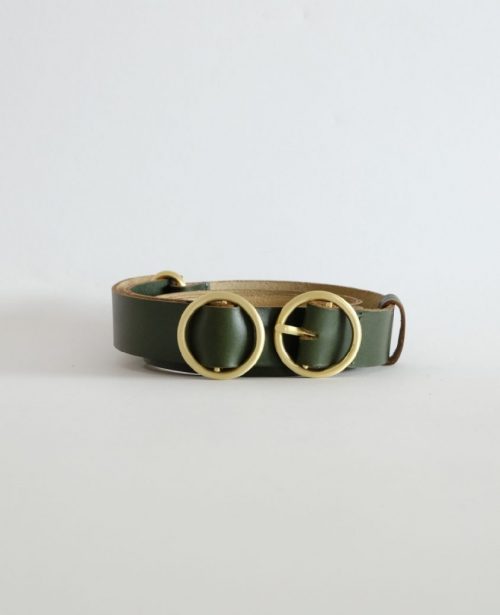 a green adjustable belt with brass hardware