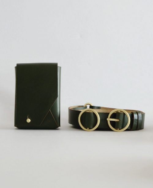 a compact green bag and a green leather belt